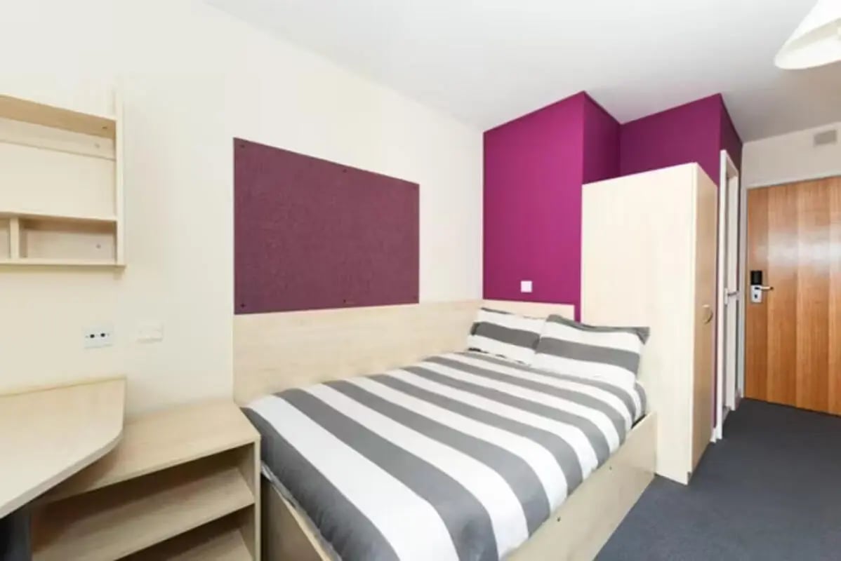Bed wardrobe corkboard and desk bedroom at Newcastle 1 in Newcastle Upon Tyne Student Accommodation