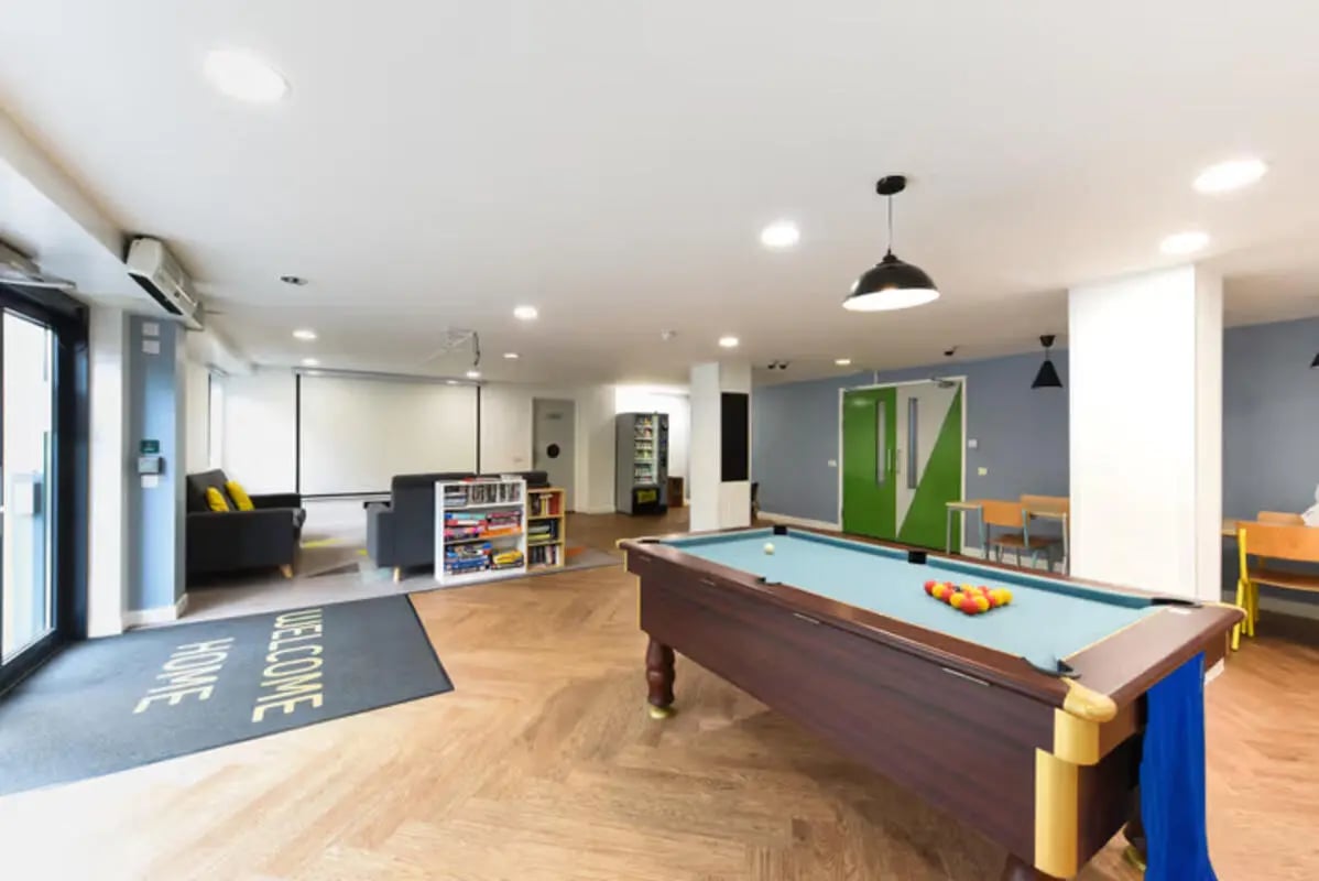 Pool table sofas bookshelves vending machine lounge at Newcastle 1 in Newcastle Upon Tyne Student Accommodation