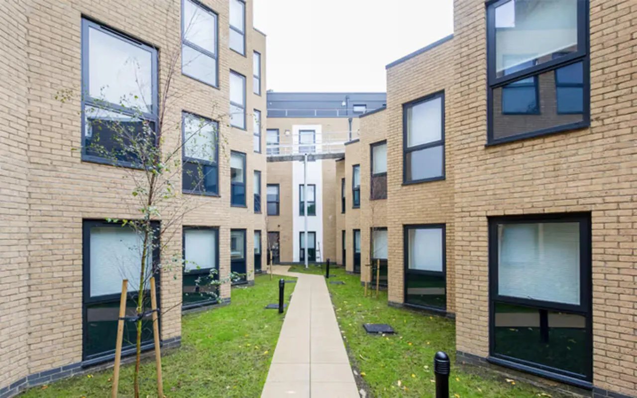 Modern student accommodation courtyard with path exterior at The Hub in London Student Accommodation