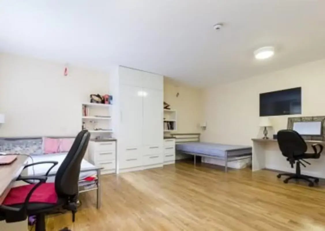 Bed desk wardrobe and TV student studio interior at The Hub in London Student Accommodation
