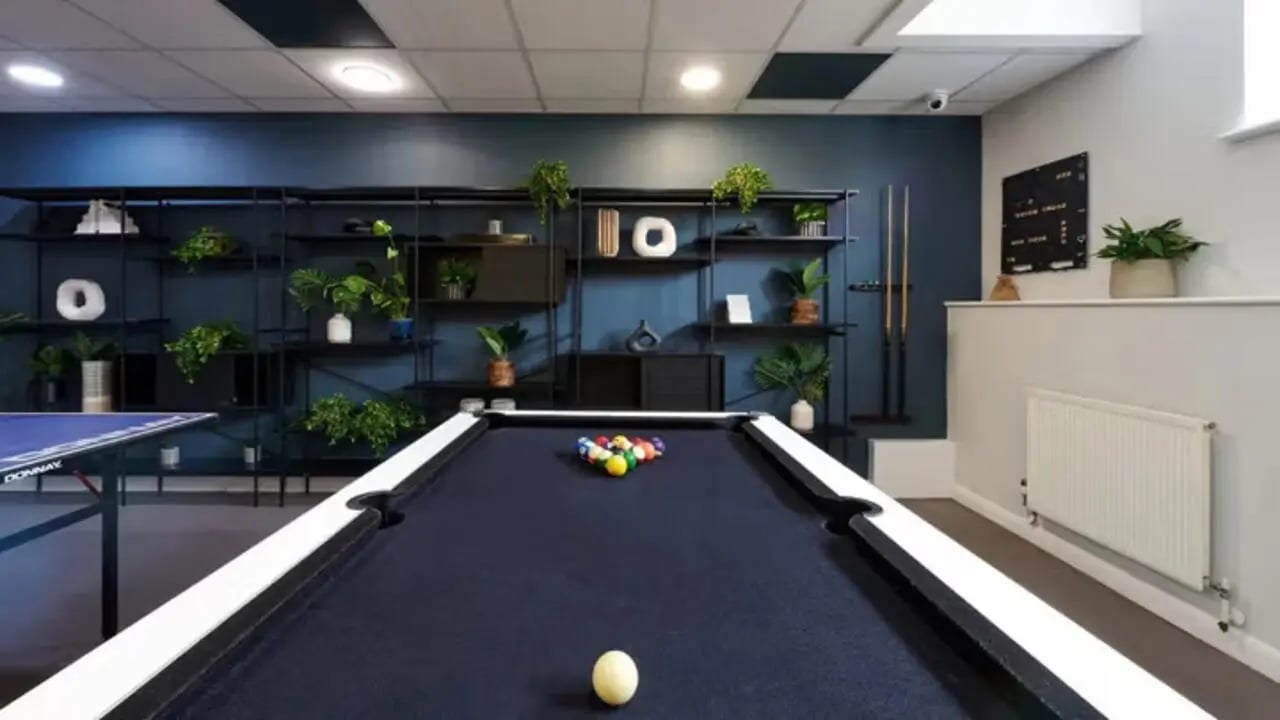 Pool table with balls and ping pong table recreation area at The Hub in London Student Accommodation
