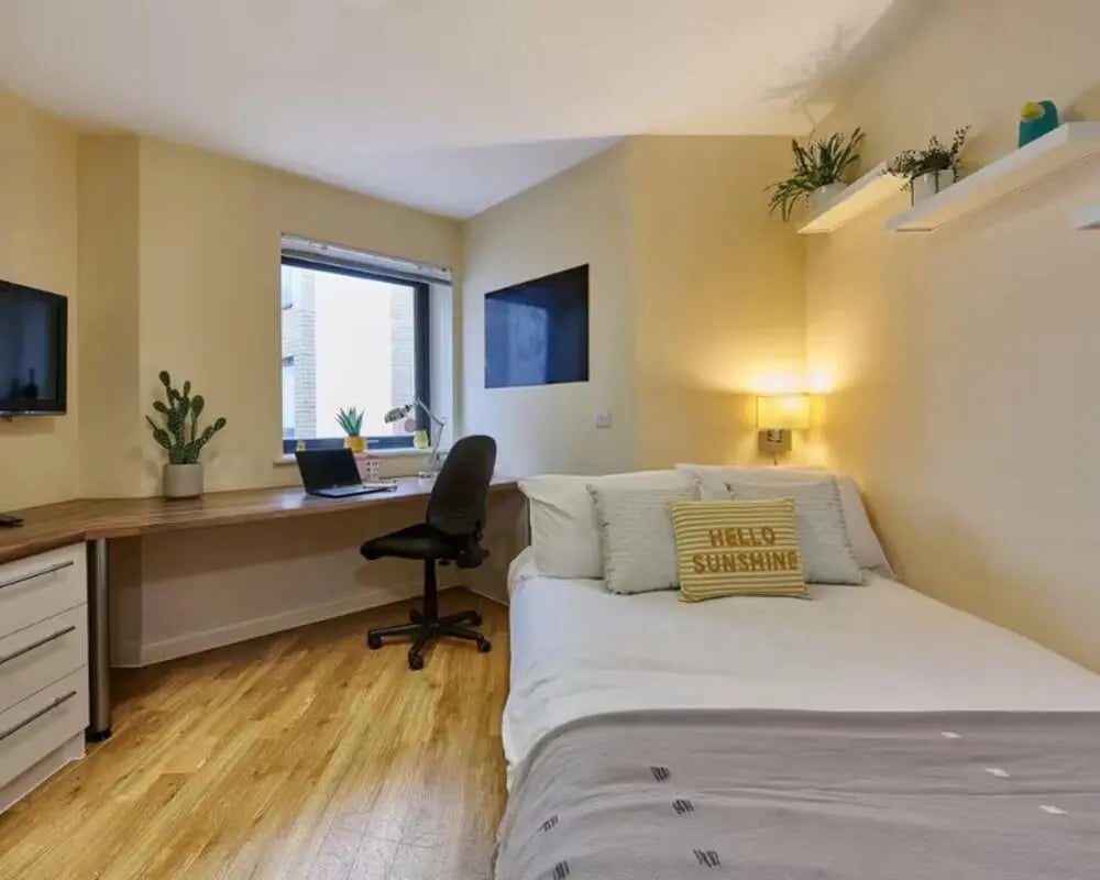 Bed desk chair and TV Bedroom at The Hub in London Student Accommodation