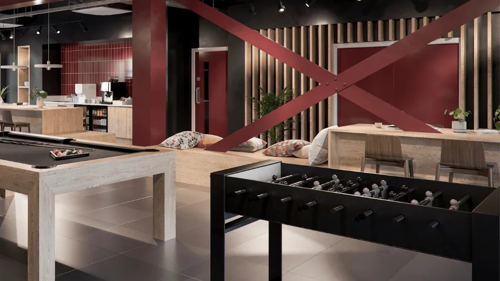 Pool table foosball table kitchen and seating area living room at Exchange Court in Leeds Student Accommodation