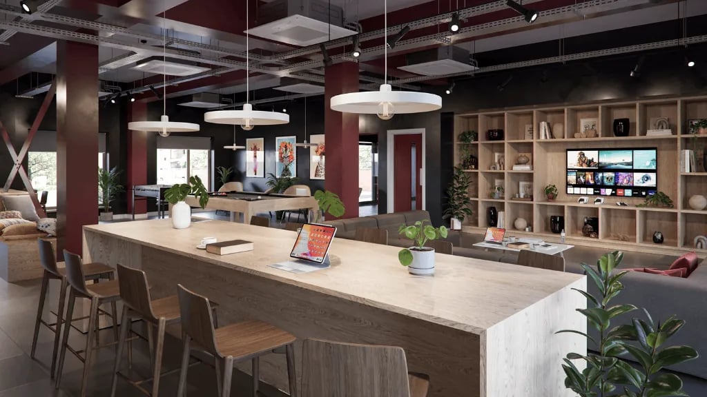 Bar stools and counter with tablet and plants communal area at Exchange Court in Leeds Student Accommodation
