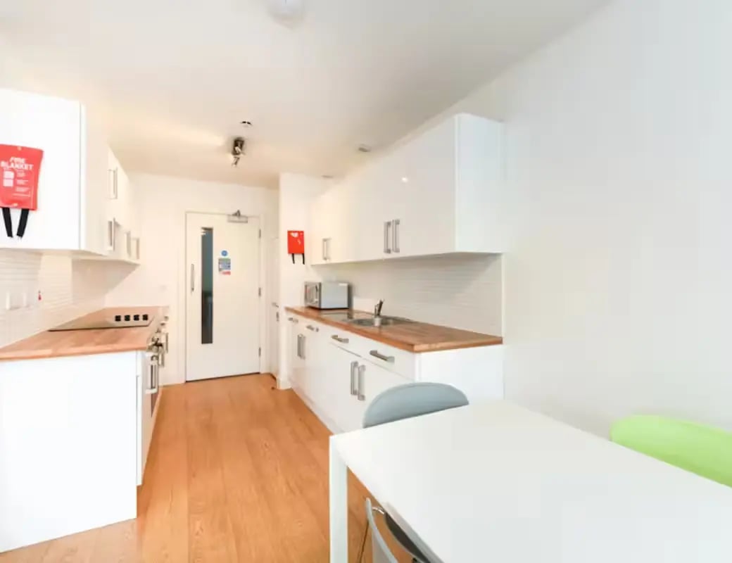 White cabinets countertop appliances fire blanket kitchen at The Summit Leicester in Leicester Student Accommodation