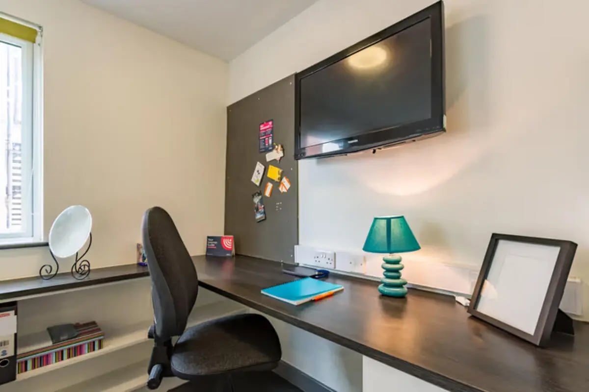 Desk chair lamp television framed photo study area at Russell View in Nottingham Student Accommodation