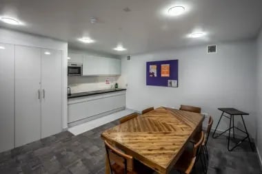 Kitchen with dining table and chairs kitchen at Meadow Court in Edinburgh Student Accommodation