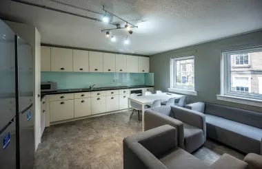 Modern kitchen with seating and lounge area interior at Meadow Court in Edinburgh Student Accommodation