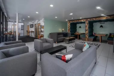 Sofa seating and booths communal lounge living room at Meadow Court in Edinburgh Student Accommodation