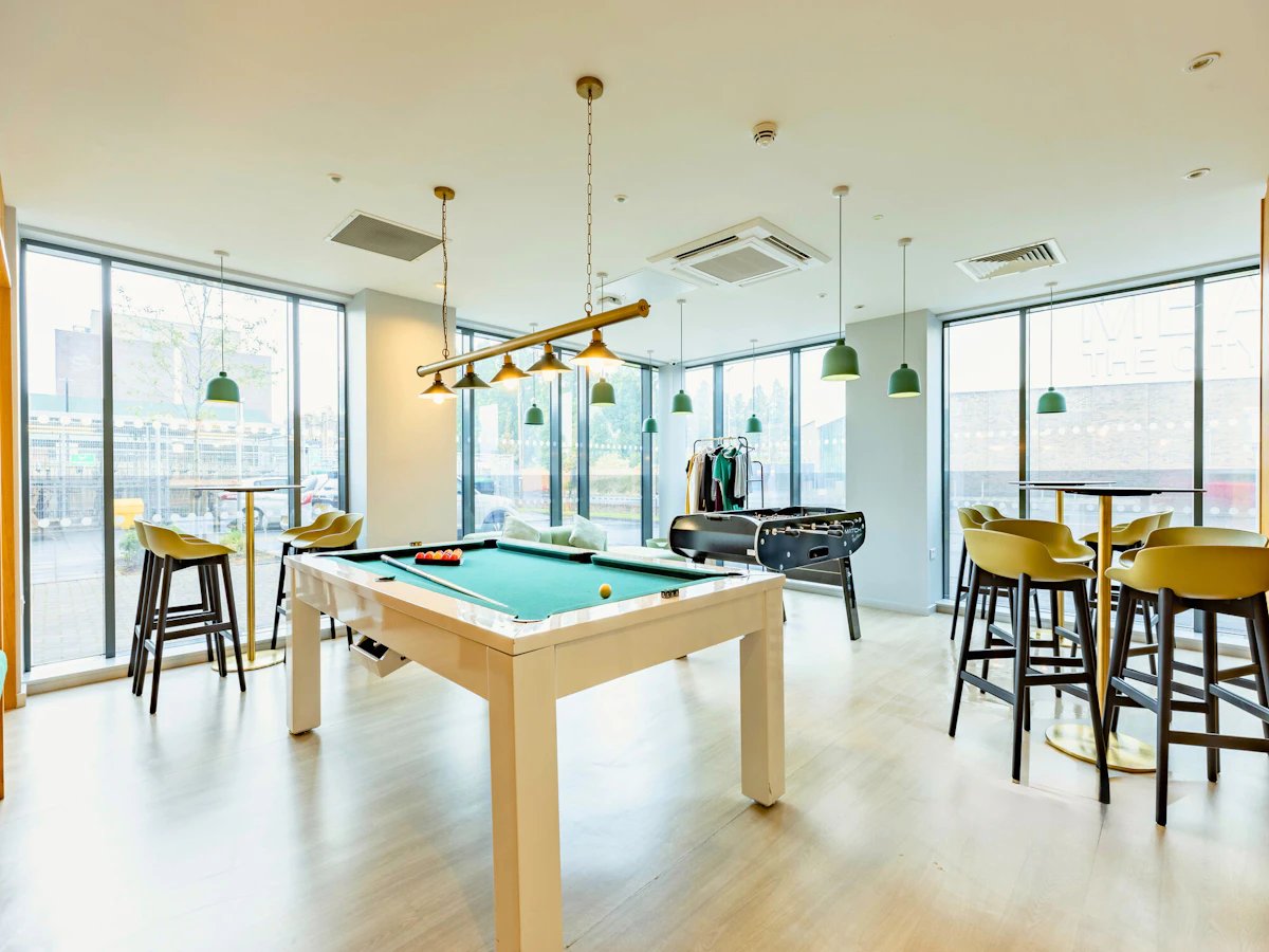 Pool table foosball table bar stools game room at Straits Meadows in Edinburgh Student Accommodation