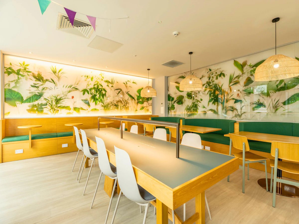 Banquette seating communal table and chairs communal area at Straits Meadows in Edinburgh Student Accommodation