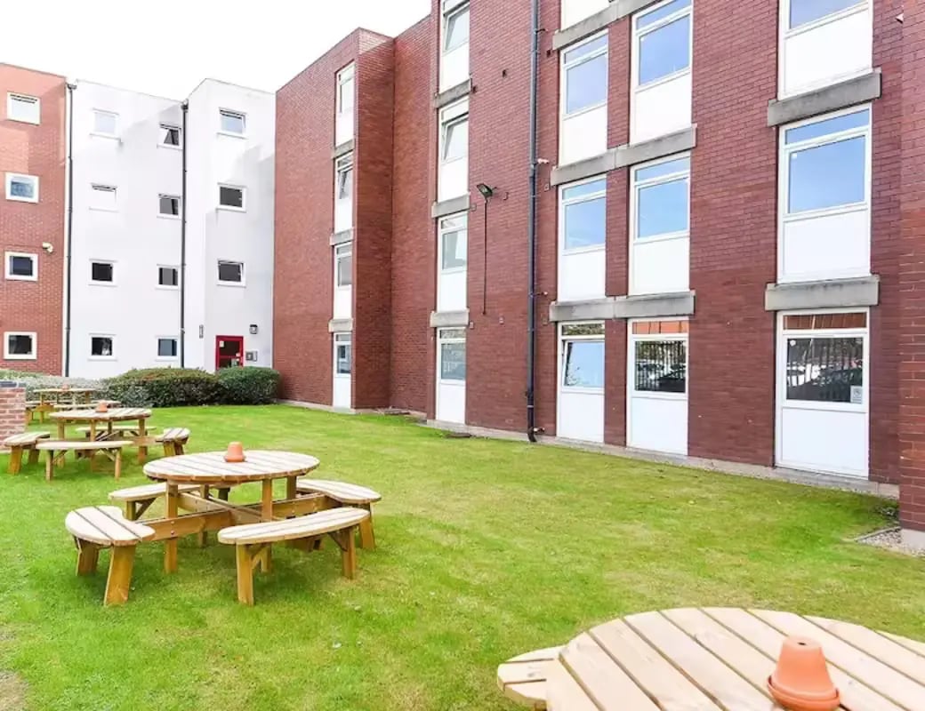 Picnic tables on lawn student accommodation exterior at Queens Court Leicester in Leicester Student Accommodation