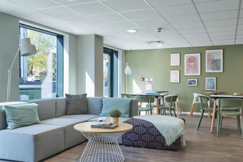 Grey sectional sofa coffee table ottoman and tables living room at The Bank Southampton in Southampton Student Accommodation