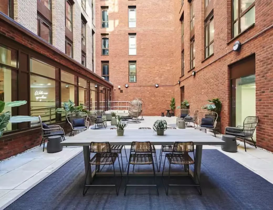 Courtyard table chairs lounge seating exterior courtyard at York House in Nottingham Student Accommodation
