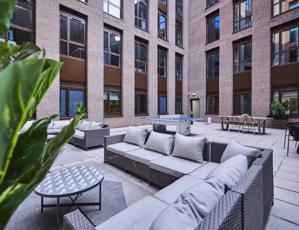 Courtyard seating ping pong table dining table exterior at York House in Nottingham Student Accommodation