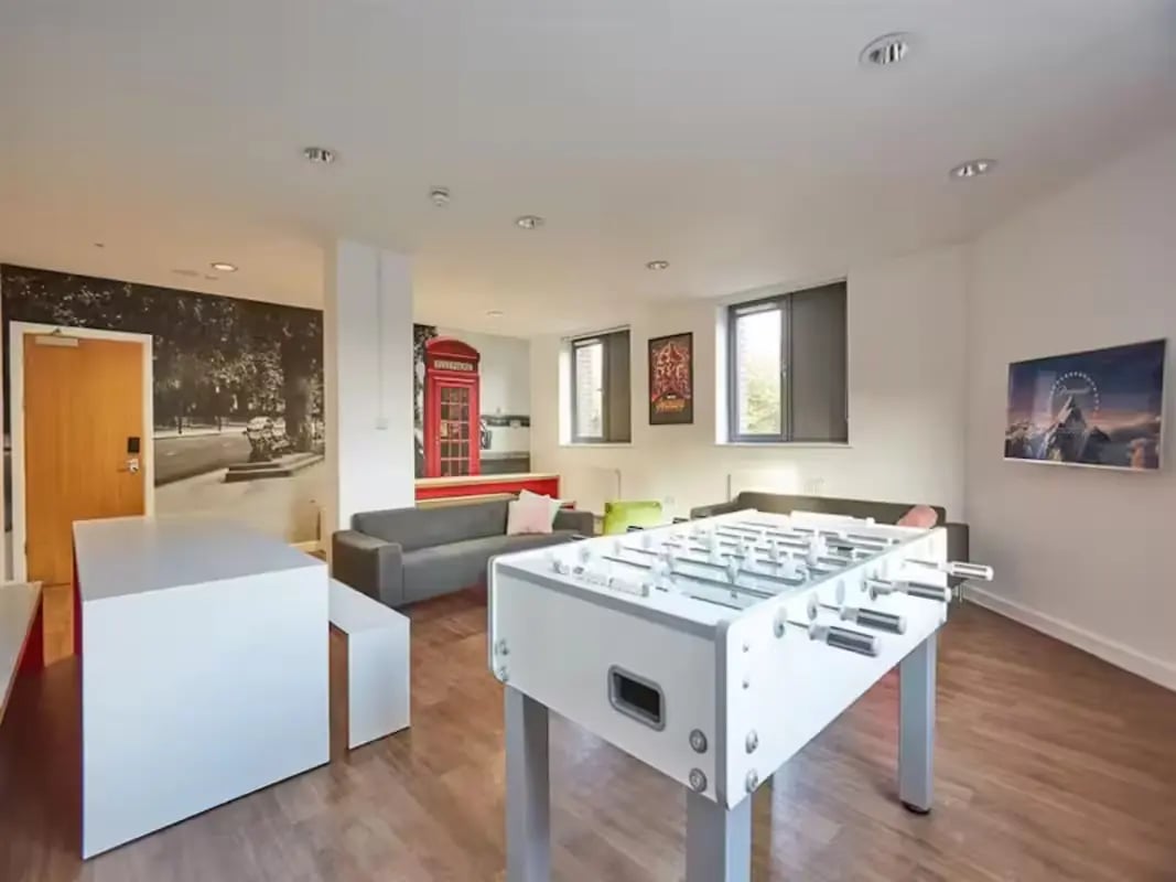 Foosball table couches and London phone booth communal area at Central Studios - London in London Student Accommodation