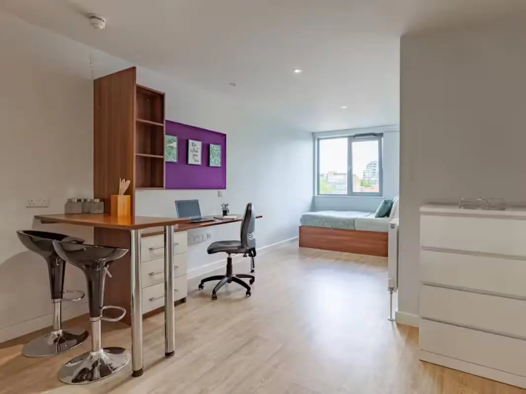 Desk, stools, bed, dresser, study area at Central Studios - London in London Student Accommodation