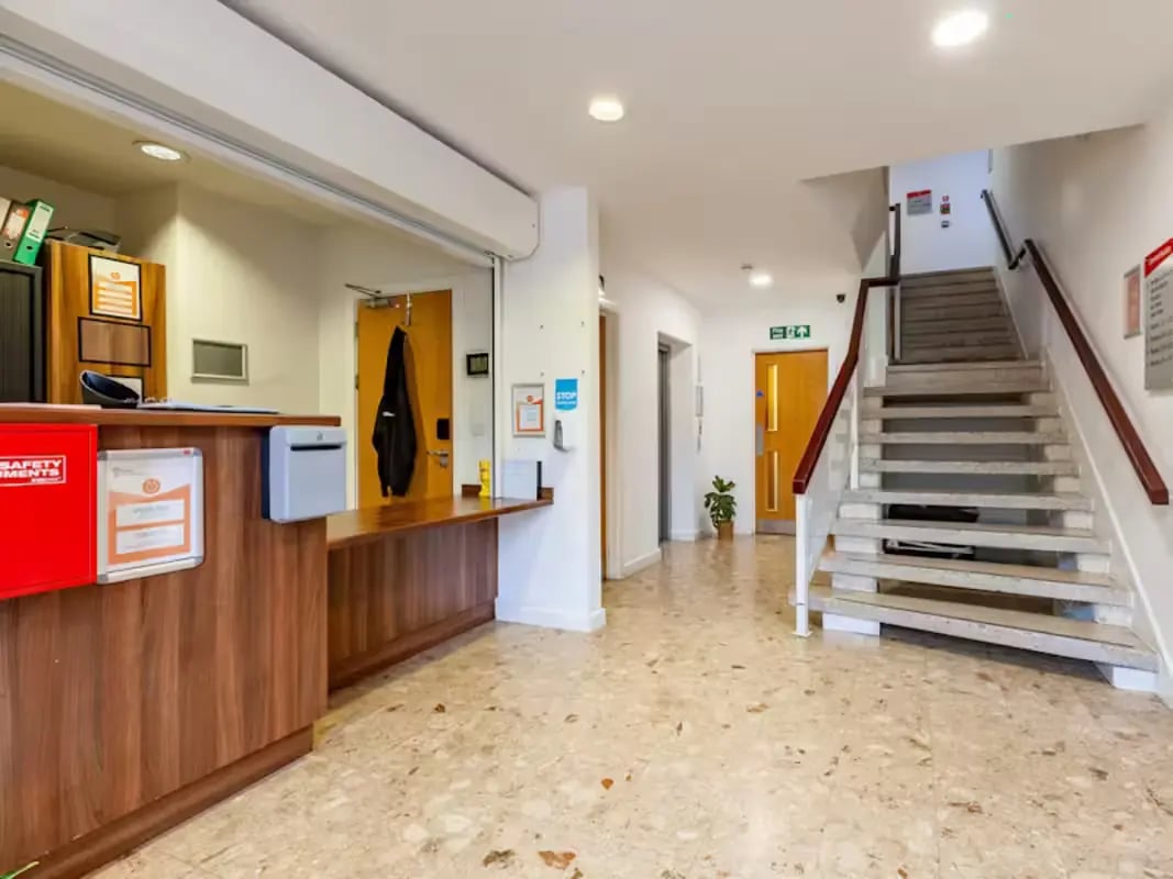 Reception desk stairs elevator and entrance hall exterior at Central Studios - London in London Student Accommodation