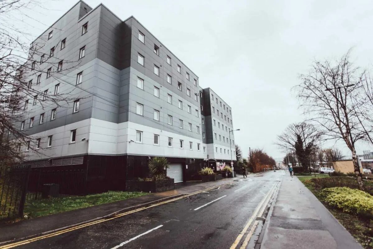 Modern grey apartment building with many windows exterior at Longside House Bradford in Bradford Student Accommodation