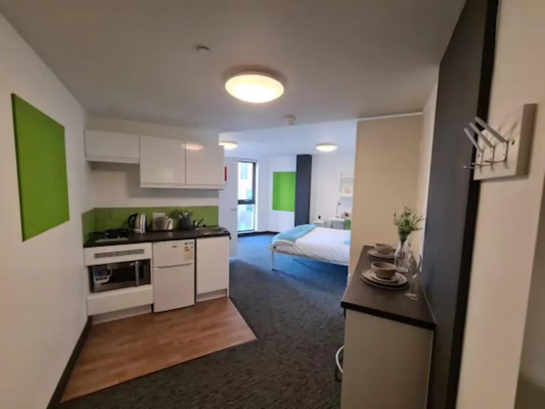 Kitchenette bed and desk student studio apartment at St James Point in Newcastle Upon Tyne Student Accommodation