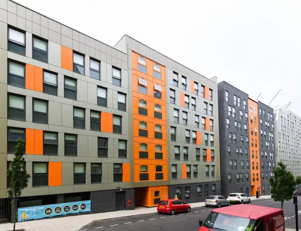 Modern apartment building with orange accents exterior at St James Point in Newcastle Upon Tyne Student Accommodation