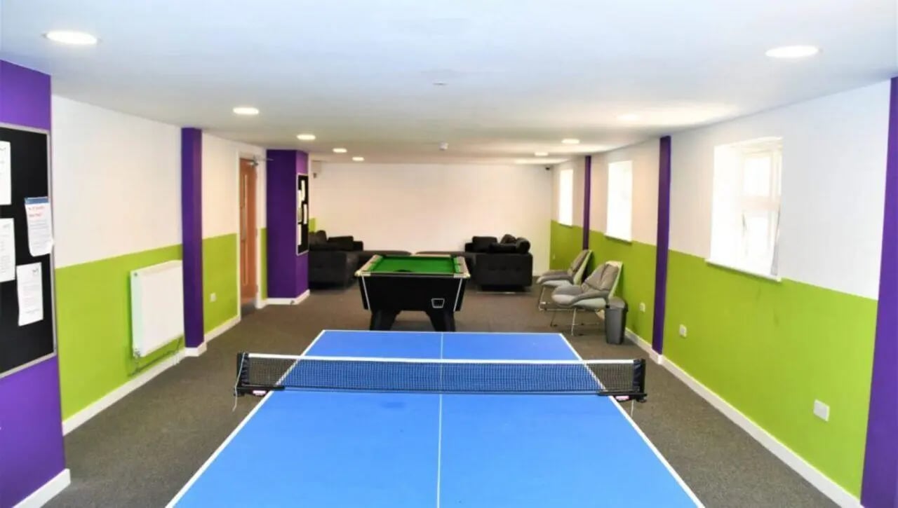 Ping pong table pool table sofas chairs playing area at Tudor Studios in Leicester Student Accommodation