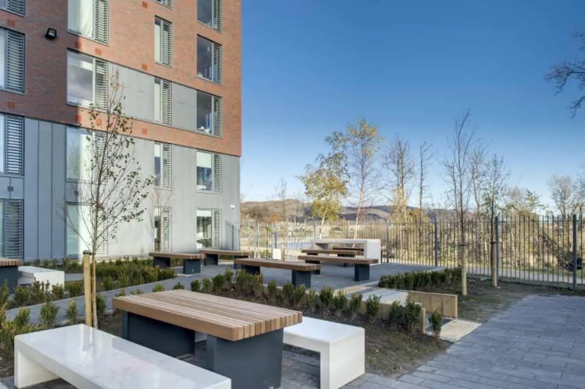 Modern building with outdoor seating area exterior at Riverside Quay in Stirling Student Accommodation