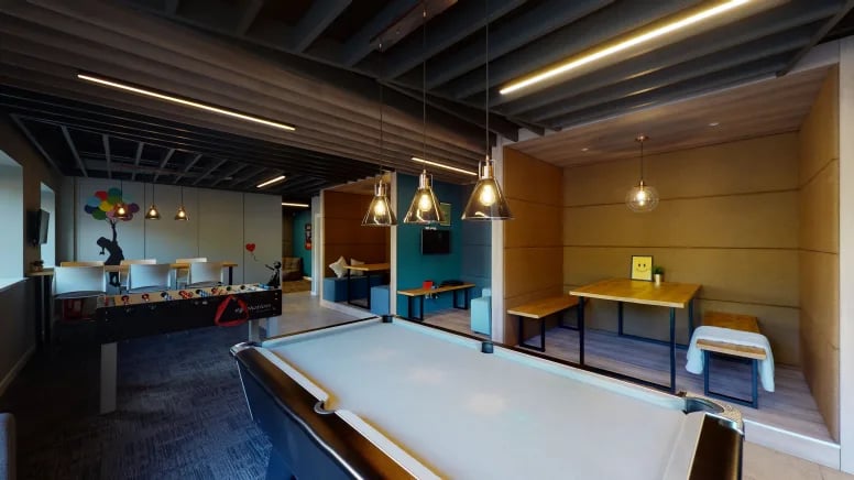Pool table foosball table seating areas common room at Centro House in Stirling Student Accommodation