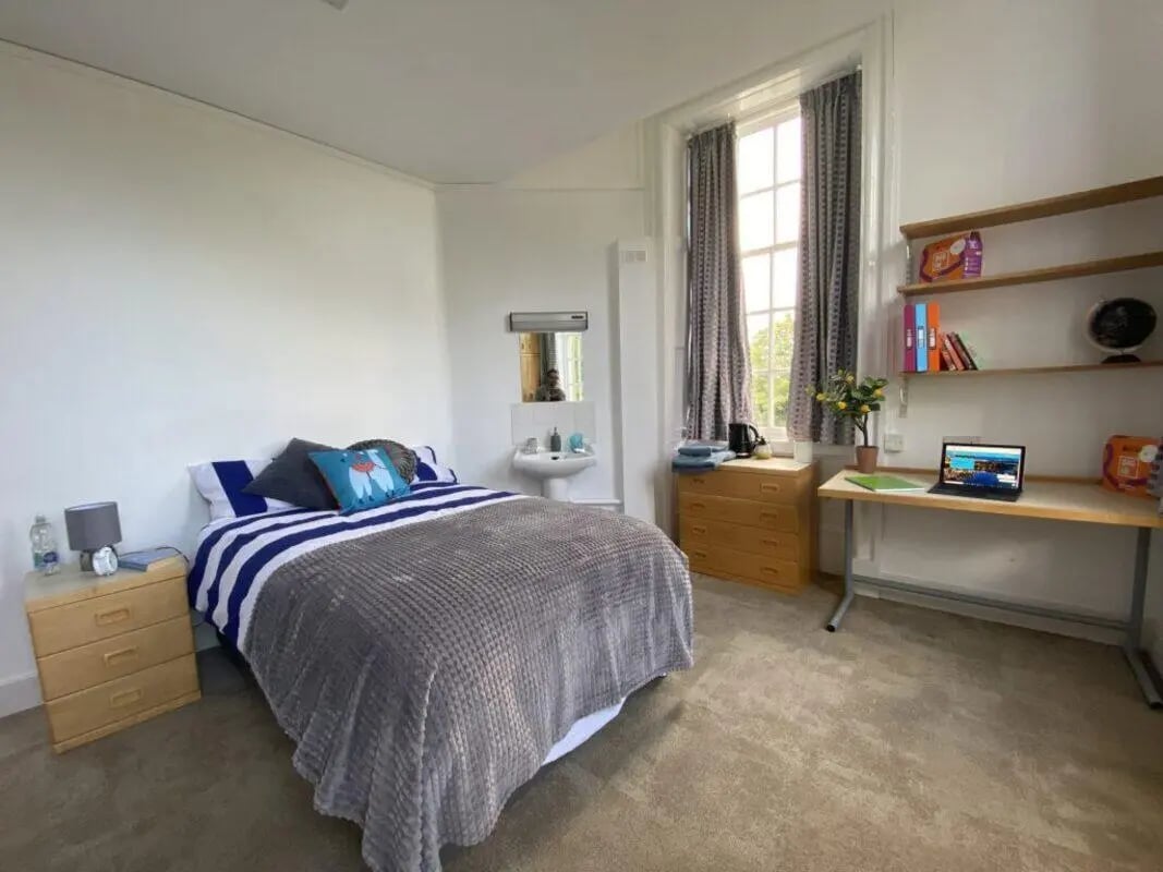 Bed desk sink dresser and shelving bedroom at St Mary's Newcastle in Newcastle Upon Tyne Student Accommodation