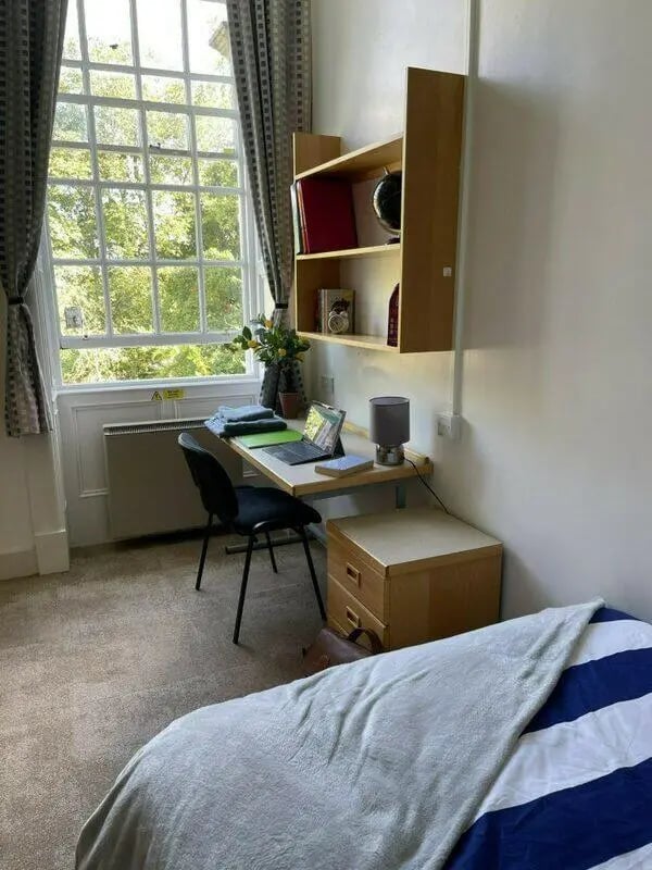 Desk shelf bed and window study area at St Mary's Newcastle in Newcastle Upon Tyne Student Accommodation