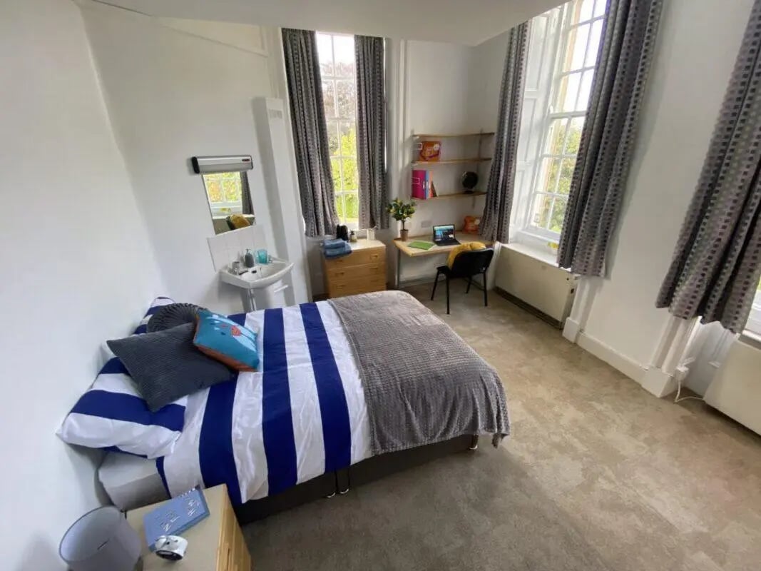 Bed sink desk and chair bedroom at St Mary's Newcastle in Newcastle Upon Tyne Student Accommodation