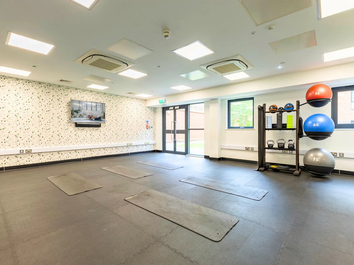 Yoga mats exercise equipment TV gym playing area at Clifford House in Exeter Student Accommodation