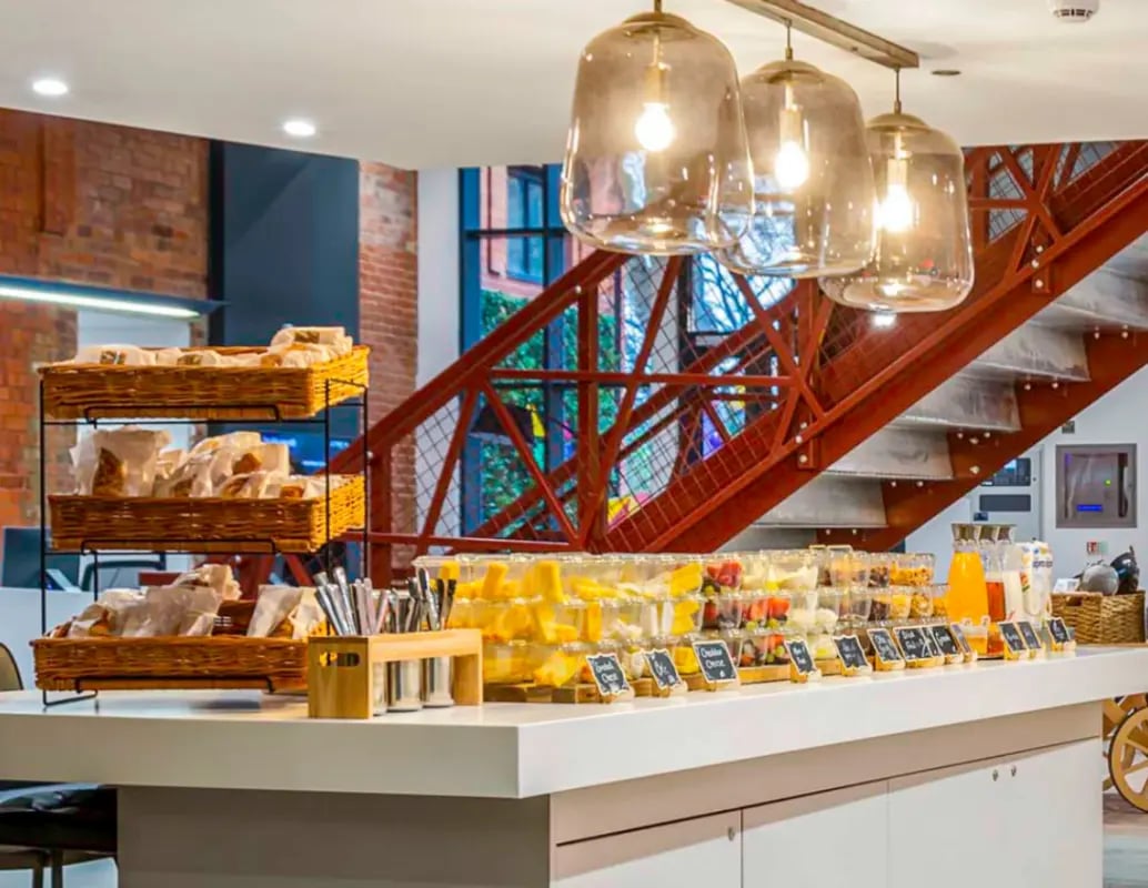Food display with baskets and drinks communal area at Gravity in Lincoln Student Accommodation