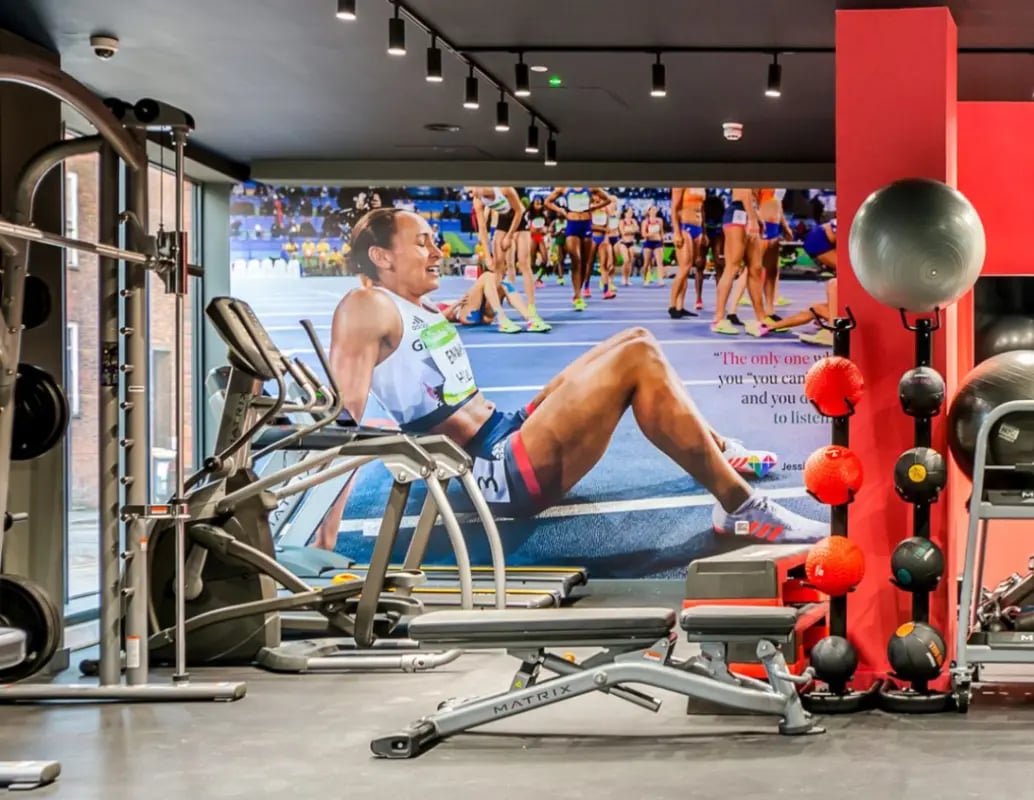 Gym equipment with athlete mural gym area at Gravity in Lincoln Student Accommodation
