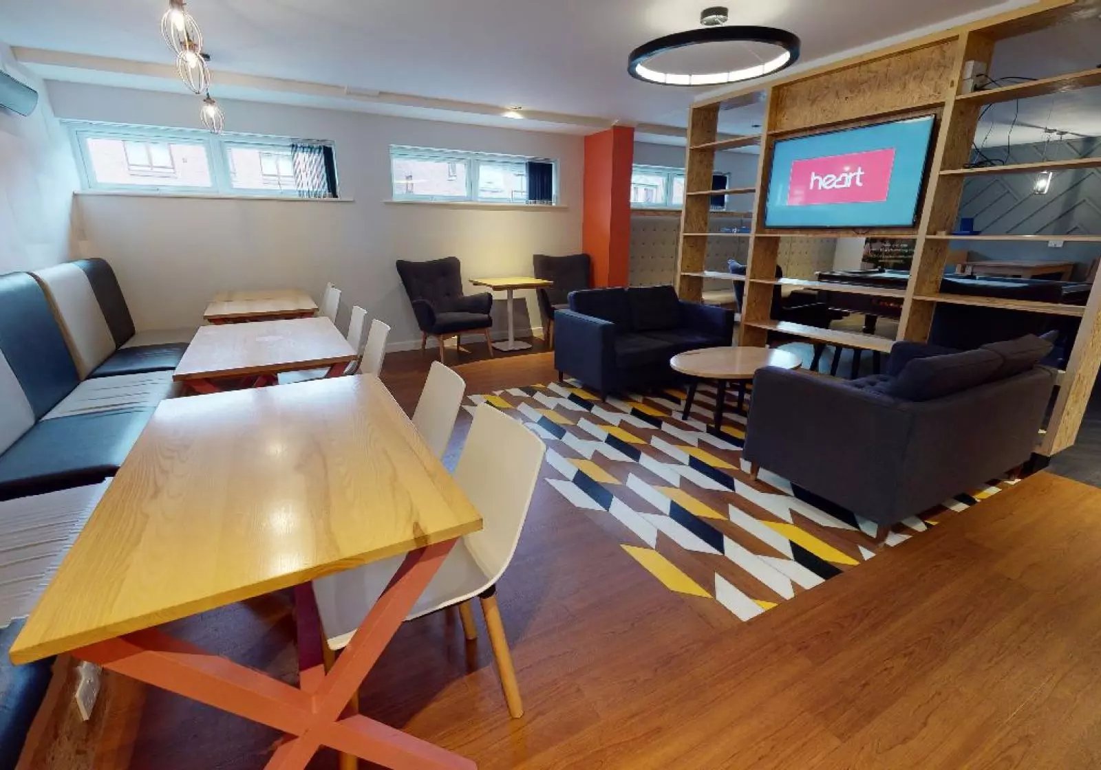 Seating tables sofas television communal area at iQ Kopa in Preston Student Accommodation