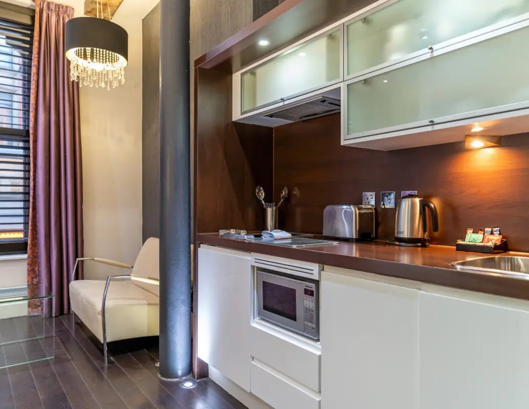 Sofa microwave toaster kettle kitchen area at IconInc Manchester City in Manchester Student Accommodation