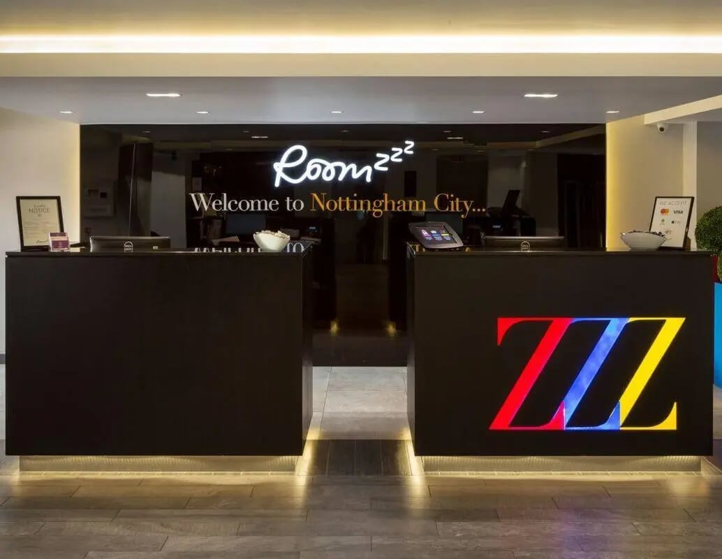 Front desk reception with modern signage and lighting reception at IconInc Nottingham City in Nottingham Student Accommodation
