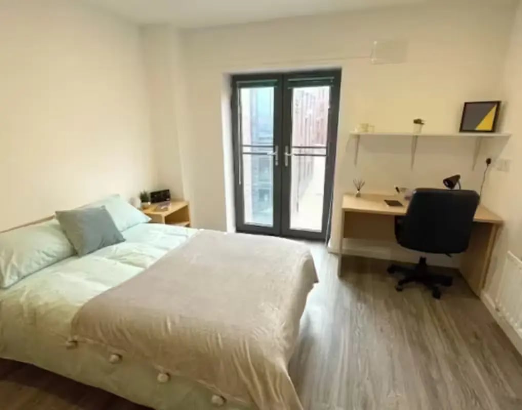 Bed desk chair and shelves bedroom at Page Apartments @ Central Place in Sheffield Student Accommodation
