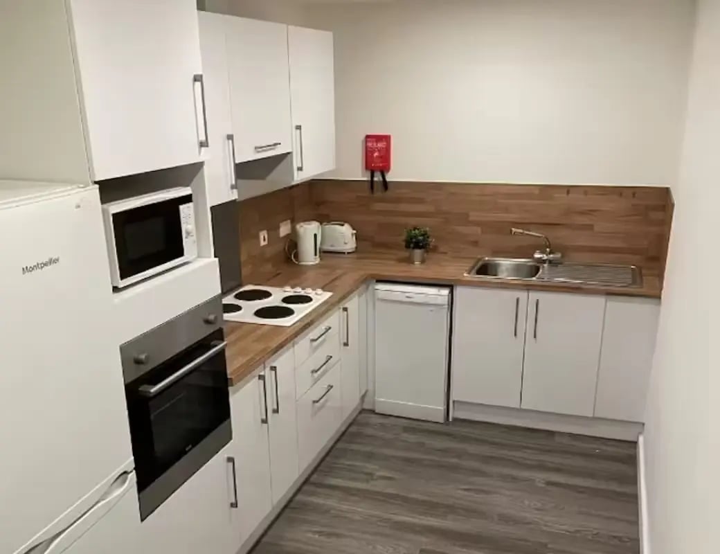 Compact kitchen with appliances cabinets sink kitchen at Page Apartments @ Central Place in Sheffield Student Accommodation