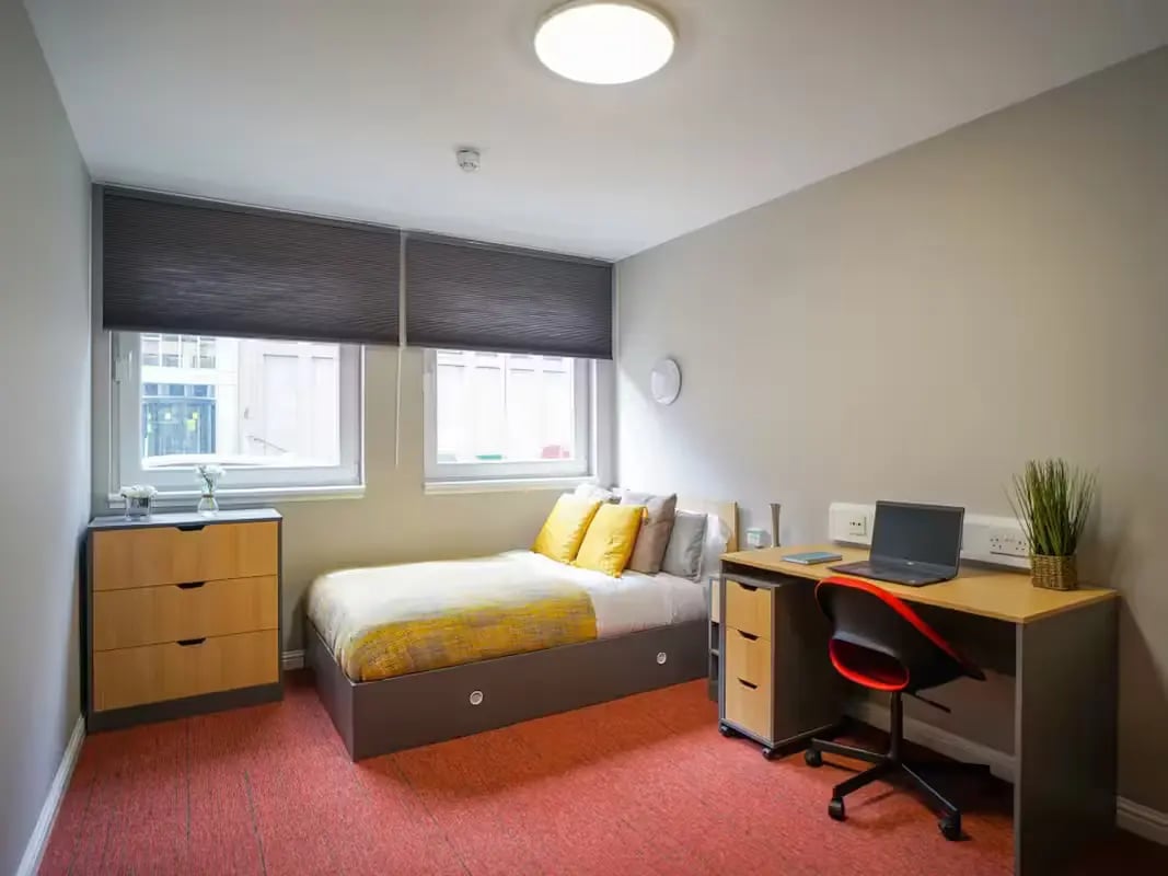Bed desk dresser and chair bedroom at 8 Roxburgh in Edinburgh Student Accommodation