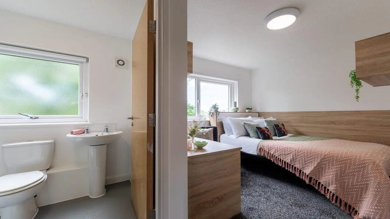 Toilet sink window and bed bedroom and bathroom at dwell Cathedral Campus in Liverpool Student Accommodation