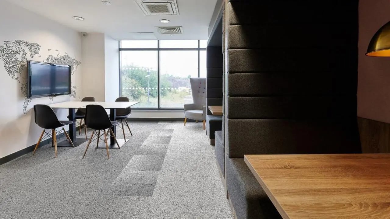 Table chairs TV and booths communal area at Heantun Point in Wolverhampton Student Accommodation