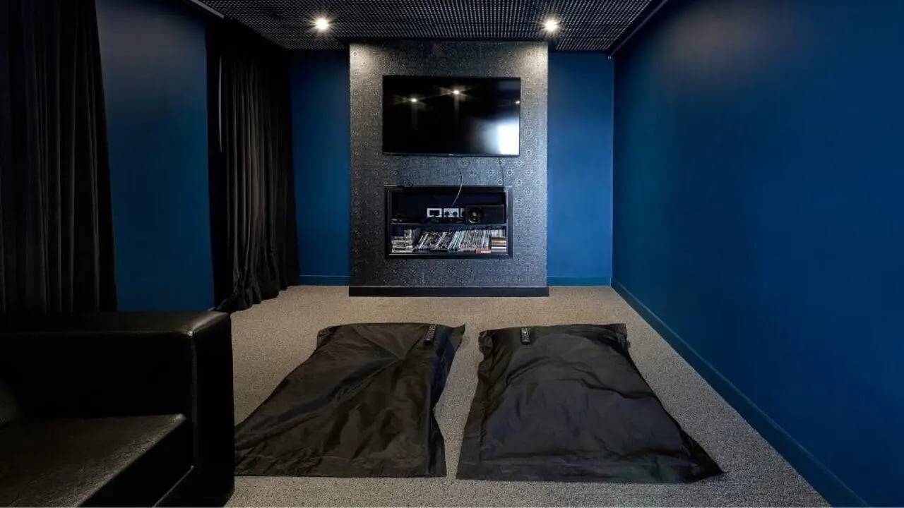 Black leather couch two beanbags screen entertainment unit playing area at Heantun Point in Wolverhampton Student Accommodation