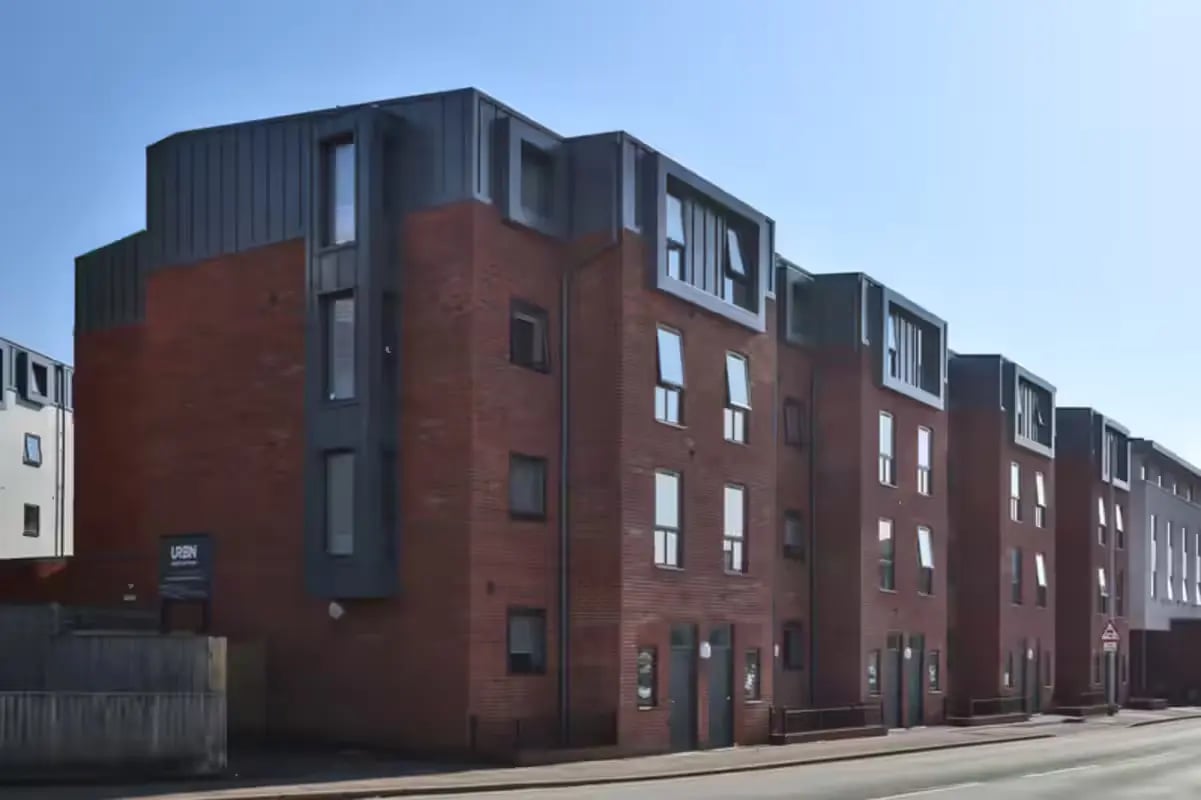 Modern brick building with many windows exterior at Clifton Place in Exeter Student Accommodation