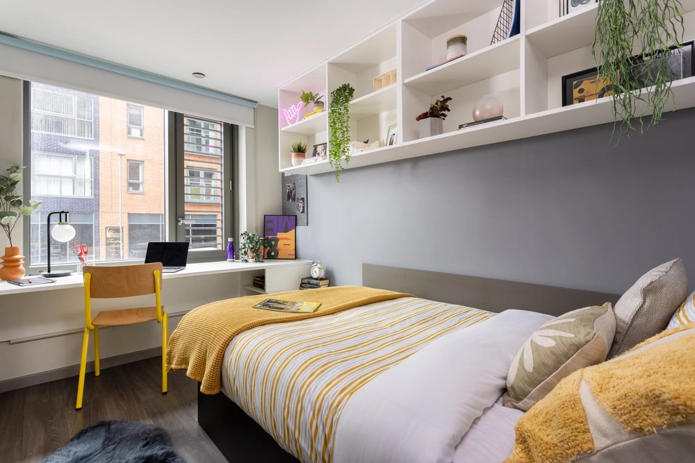 Desk, laptop, bed, shelves, bedroom at St Lukes View in Liverpool Student Accommodation