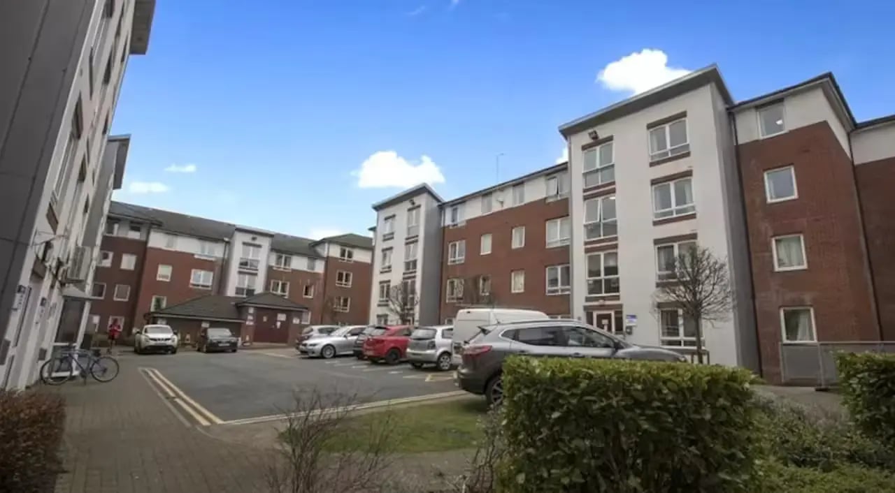 Modern apartment buildings with cars and bike exterior at Foundry Court in Preston Student Accommodation