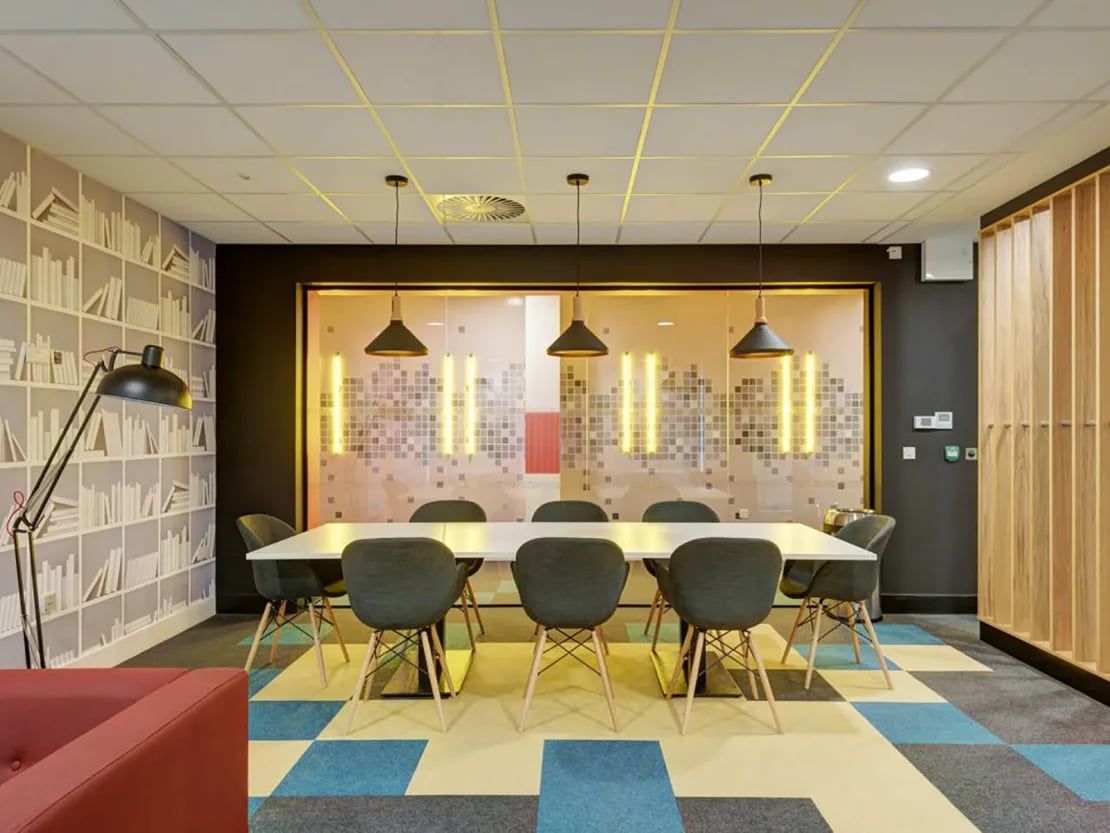 Table and chairs with modern lighting study area at New Bridewell in Bristol Student Accommodation