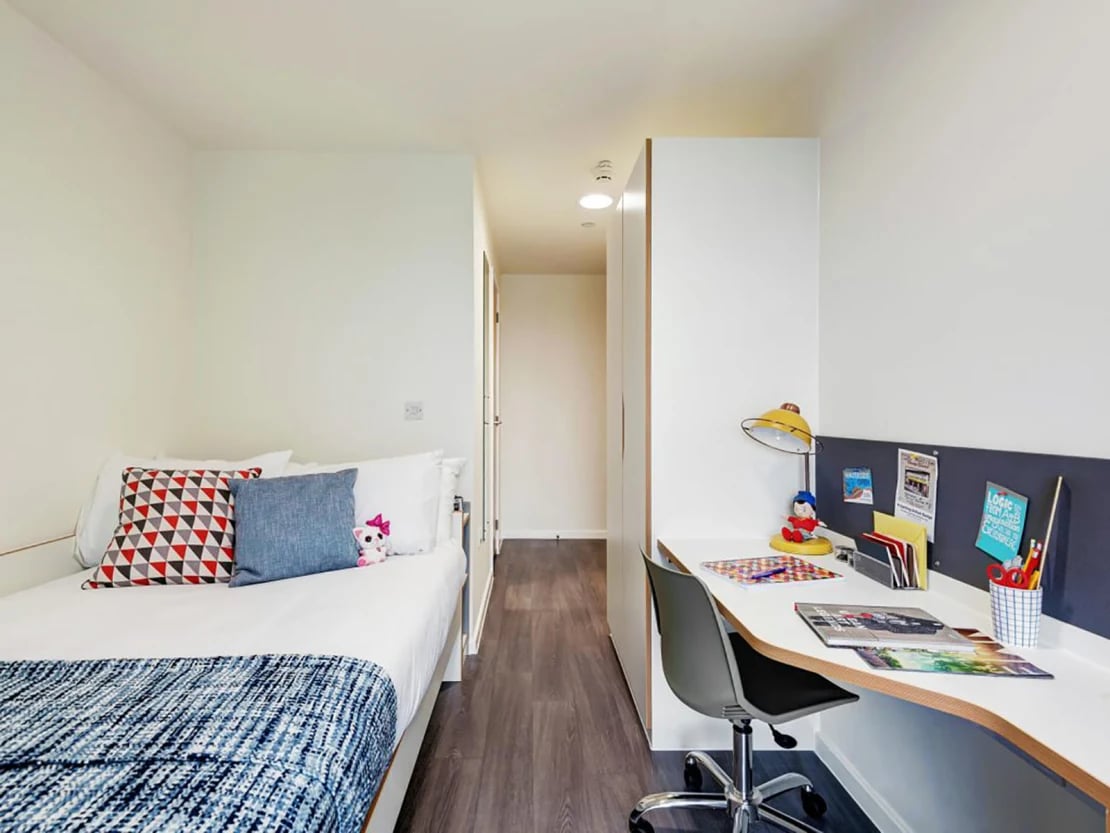 Bed desk chair and lamp bedroom at New Bridewell in Bristol Student Accommodation