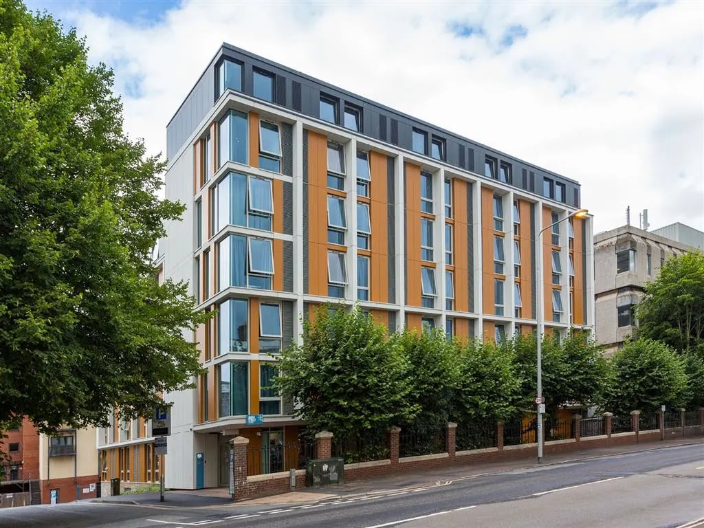 Modern building with many windows exterior at Queen Street Studios in Exeter Student Accommodation