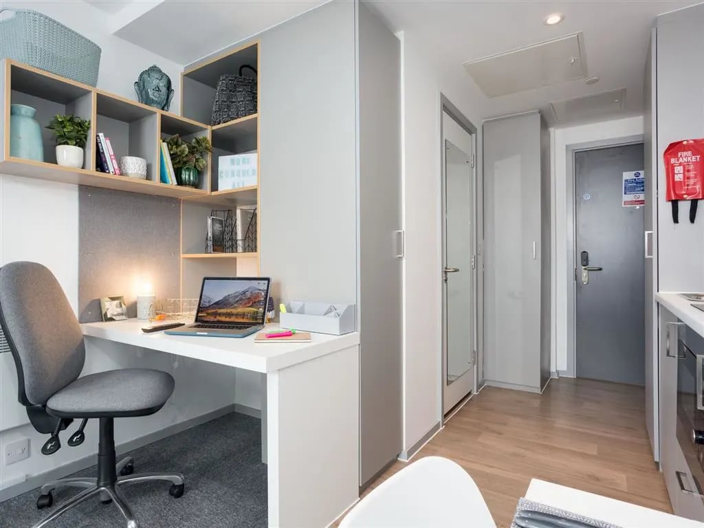 Desk chair laptop shelves and doorway student studio at Queen Street Studios in Exeter Student Accommodation